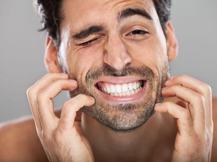 Man scratching itchy beard, showing discomfort, beard care concept, Hairy Man Care