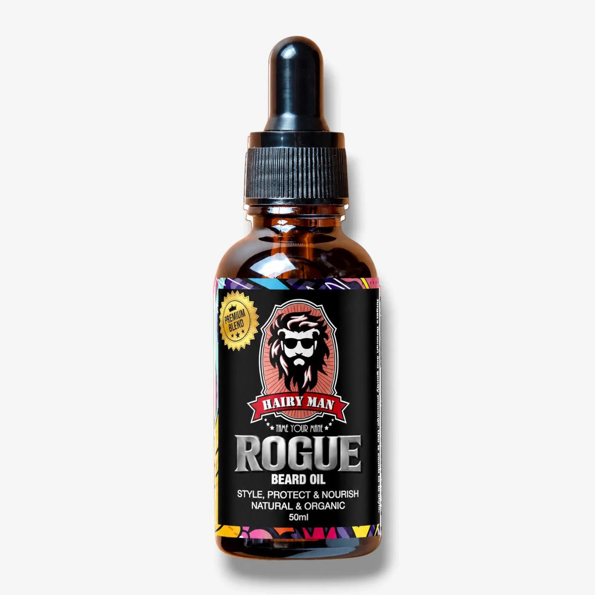 A 50ml amber glass dropper bottle of Hairy Man Rogue Beard Oil with a black label and black dropper cap, set against a light gray background.