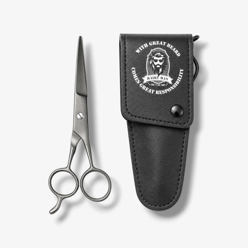 Beard scissors with black leather case, engraved 'Hairy Man' logo for grooming.