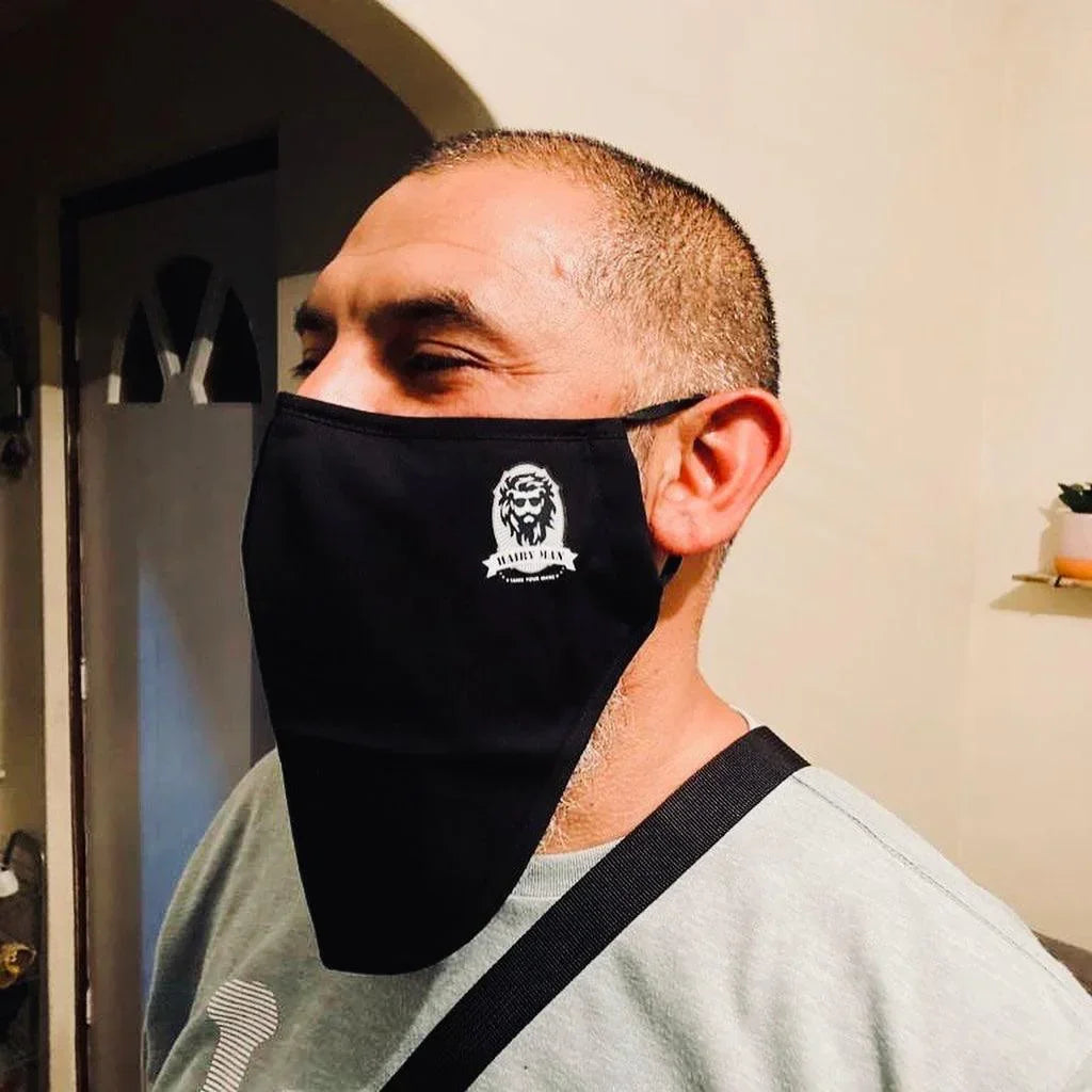 Man wearing black Hairy Man face mask with beard logo, showcasing beard care brand apparel