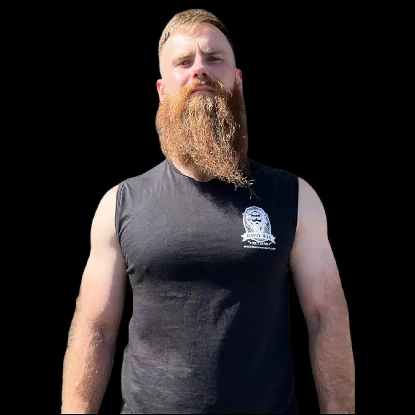 Man with thick red beard wearing Hairy Man Care tank top, showcasing natural beard care results