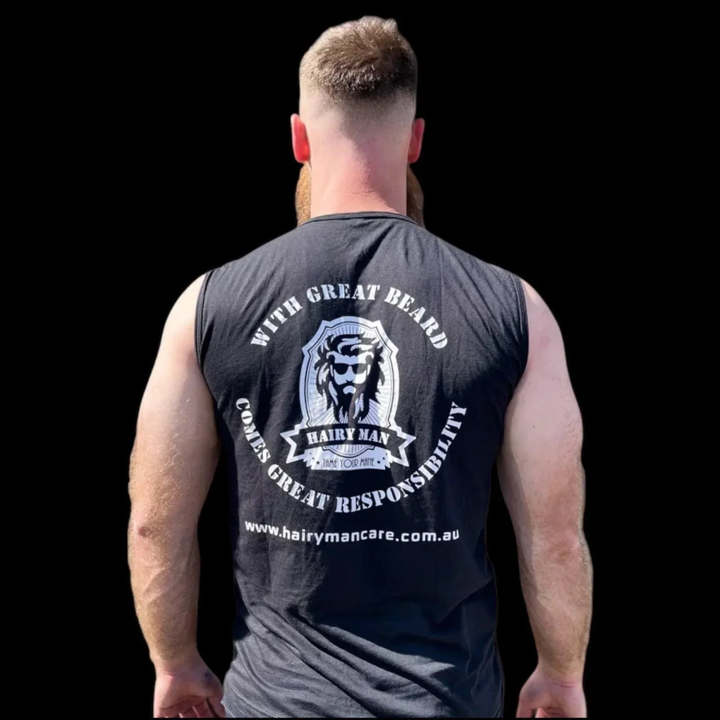 Man with beard wearing 'Hairy Man' tank top, back view, black background